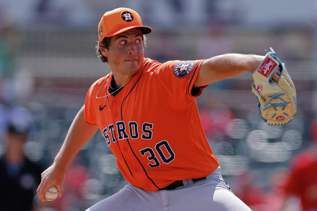 Houston Astros relief pitcher Jake Bloss (30) delivers a pitch during an MLB Spring Breakout game against the St. Louis Cardinals on March 17, 2024 at Roger Dean Chevrolet Stadium in Jupiter, Florida.