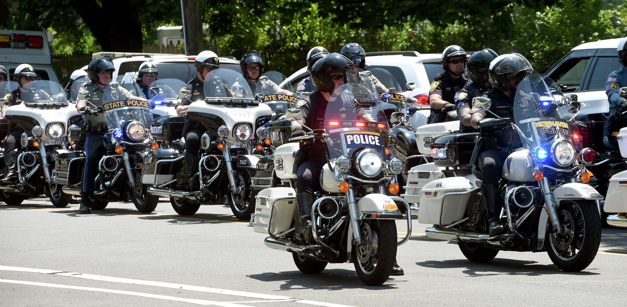 Connecticut trooper sues New Haven, Cheshire over crash during officer’s funeral procession