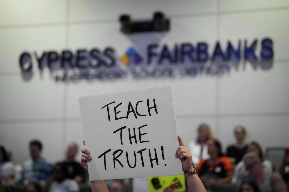 A person protests during a Cypress-Fairbanks ISD Board of Trustees meeting Monday, June 17, 2024, at Mark Henry, Ed.D. Administration Building in Cypress.