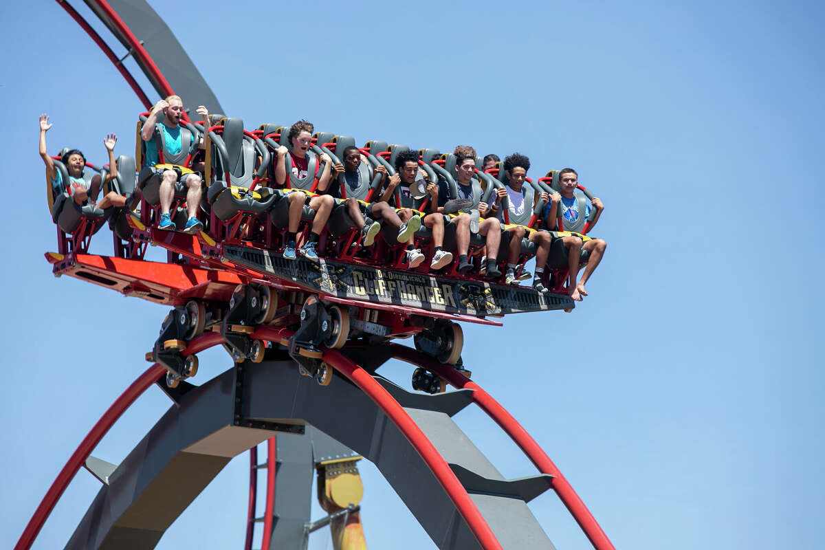 Visitors to Six Flags Fiest Texas take a ride on Dr. Diabolical's Cliffhanger, which Six Flags calls the world's steepest dive coaster, opened in 2022.