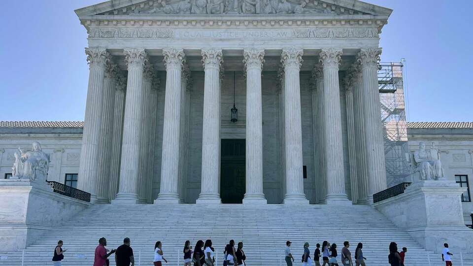 WASHINGTON, DC - JUNE 07: Tourists gather outside the U.S. Supreme Court on June 07, 2024 in Washington, DC. The court is expected to issue about 30 rulings by the end of June, including about access to abortion pills dispensed by mail, gun restrictions, the power of regulatory agencies and former President Donald Trump's bid to avoid criminal charges for trying to overturn his 2020 election defeat.