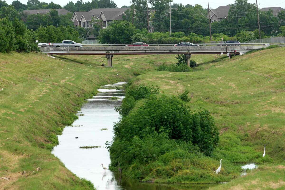 A bridge in the 400 block of West Rankin Rd. between Ella Blvd. and Kuykendahl Rd. is shown Tuesday, June 18, 2024, in Houston. Houston police are investigating the apparent homicide of a 12-year-old girl whose body was found early Monday in shallow waters of the north Houston creek.