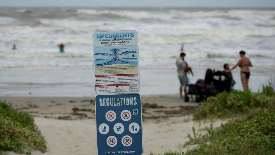 Rip currents warning sign is photographed Tuesday, June 18, 2024 along Seawall Boulevard in Galveston. National Weather Service announced Southeast Texas will be affected by Potential Tropical Cyclone One.