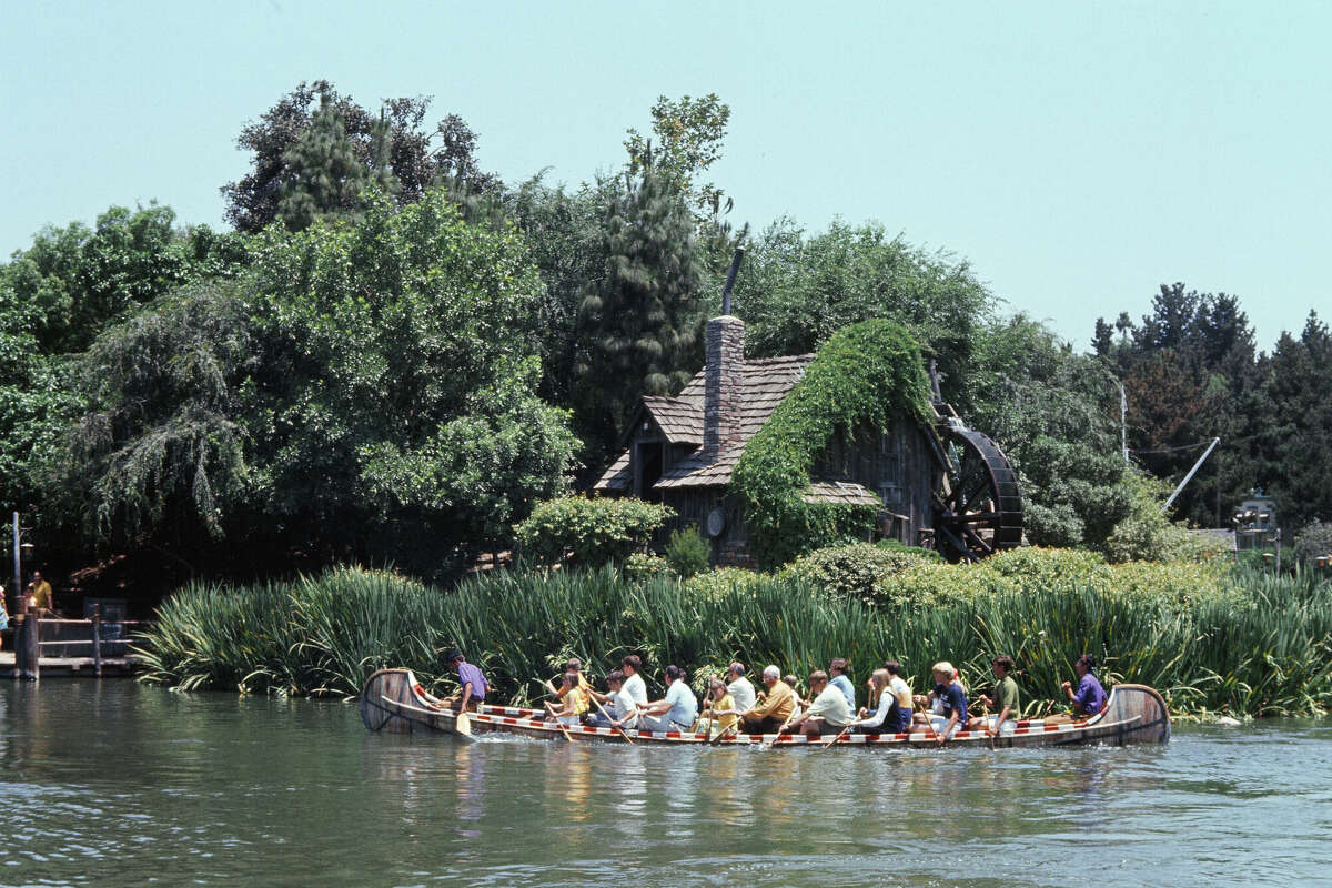 A group of guests take a trip on a canoe at Tom Sawyer Island in Disneyland in June 1970. (Photo by Monte Fresco/Mirrorpix/Getty Images)