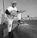 New York Giants outfielder Willie Mays turns cowboy crooner on the steps of the dugout at Phoenix, complete with hat and guitar, 1952. Willie is taking a moment out from the spring training workouts just for fun.