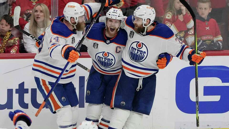 Edmonton Oilers center Connor McDavid (97) celebrates his goal during the third period of Game 5 of the NHL hockey Stanley Cup Finals against the Florida Panthers, Tuesday, June 18, 2024, in Sunrise, Fla. The Oilers defeated the Panthers 5-3.