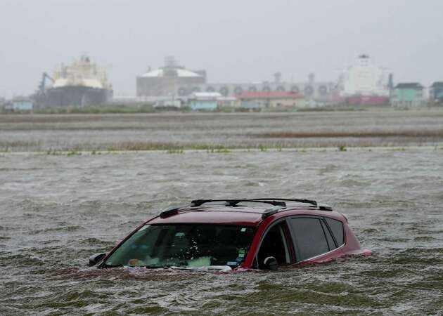 A car sits submerged in water as Tropical Storm Alberto approaches land Wednesday, June 19, 2024, in Surfside Beach.