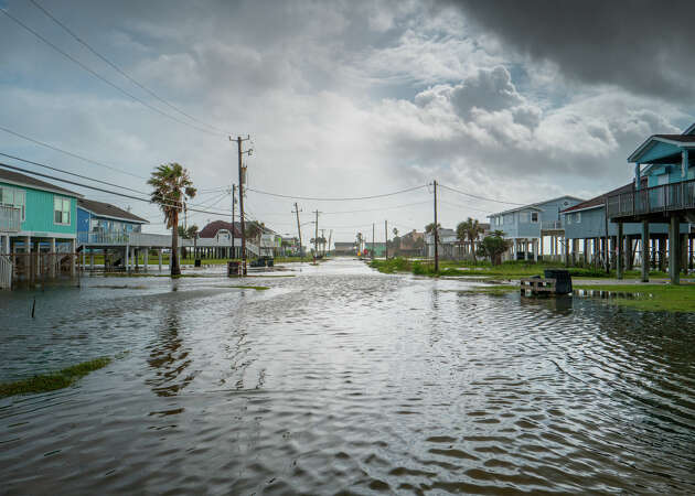 JAMAICA BEACH, TEXAS - JUNE 20: Floodwater flows through a neighborhood on June 20, 2024 in Jamaica Beach, Texas. Storm Alberto, the first named tropical storm of the hurricane season, was located approximately 305 miles south-southeast of Brownsville, Texas and formed yesterday in the Southwestern Gulf of Mexico. The storm has produced heavy winds and rainfall, creating flooding within various communities along Texas coastlines. (Photo by Brandon Bell/Getty Images)