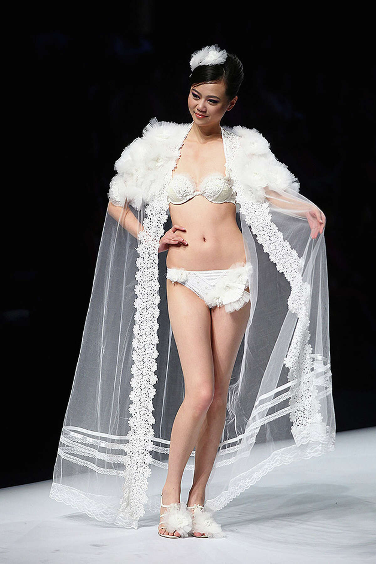 BEIJING - OCTOBER 28: A model walks the runway during Ordifen Cup China Lingerie Design Contest 2010 at China Fashion Week Spring/Summer 2011 on October 28, 2010 in Beijing, China. (Photo by Feng Li/Getty Images)