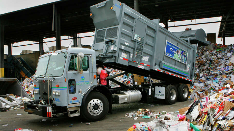 One of California Waste Solutions new recycle trucks dumps a load of recyclable materials at the San Jose facility. California Waste Solutions, Inc., is a privately owned recycling and waste management company operating in the San Francisco Bay Area since 1990. The San Jose City Council recently awarded CWS the franchise to both collect and process the city's single-family curbside recycling set-outs. Photos taken on Tuesday, July 10, 2007 in San Jose, CA.