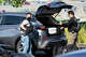 FBI agents load a box of evidence into a vehicle during a raid on California Waste Solutions in Oakland on Thursday.