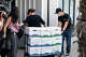 FBI agents carry boxes of evidence from a raid on California Waste Solutions in Oakland on Thursday.