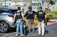 FBI agents carry a box of evidence and a battering ram out of the building during a raid on California Waste Solutions in Oakland on Thursday.