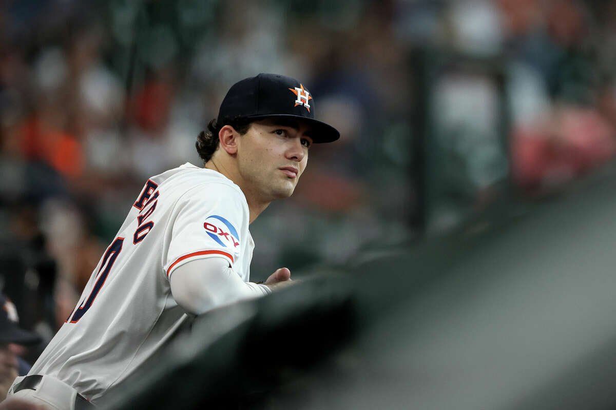 Joey Loperfido #10 of the Houston Astros watches from the dugout in the fifth inning against the Los Angeles Angels at Minute Maid Park on May 22, 2024 in Houston, Texas.