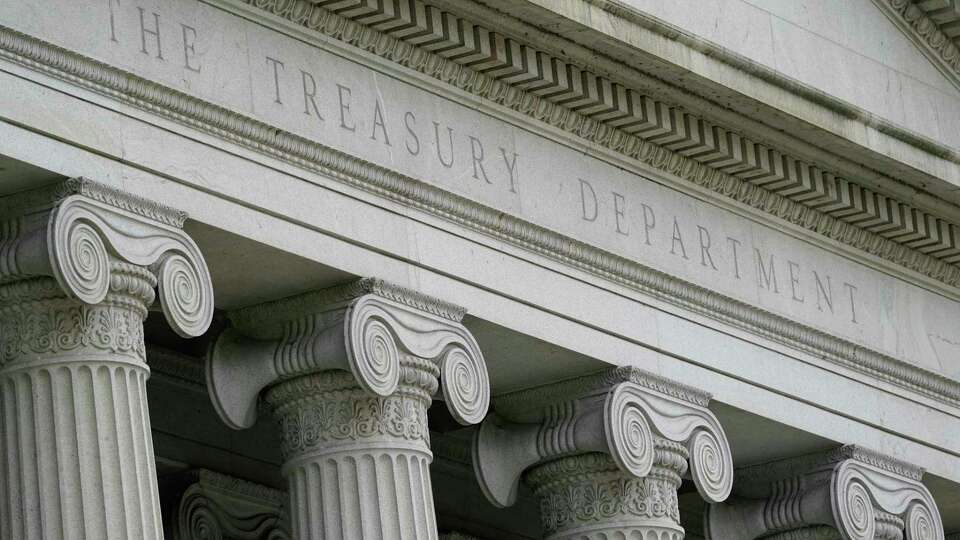 FILE - The Treasury Building is viewed in Washington, May 4, 2021. The Treasury Department has fleshed out its proposed rule that would restrict and monitor U.S. investments in China for artificial intelligence, computer chips and quantum computing. The proposed rule, released Friday, June 21, 2024, stems from President Joe Biden's August 2023 executive order regarding the access that 'countries of concern' have to American dollars funding advanced technologies that the U.S. government says would enhance their military, intelligence, surveillance, and cyber capabilities.