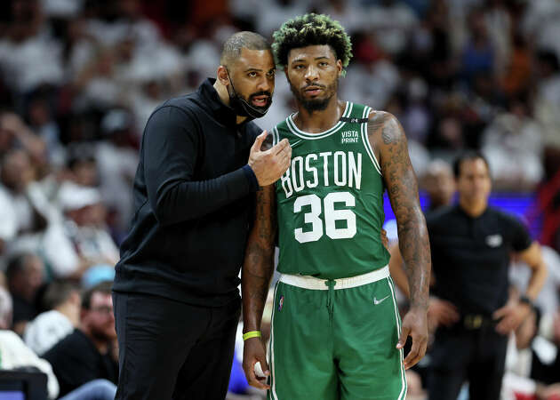 Head Coach Ime Udoka of the Boston Celtics talks with Marcus Smart #36 against the Miami Heat during the third quarter in Game Seven of the 2022 NBA Playoffs Eastern Conference Finals at FTX Arena on May 29, 2022 in Miami, Florida. 