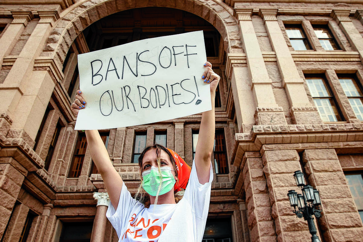 FILE - In this Sept. 1, 2021, file photo, Jillian Dworin participates in a protest against the six-week abortion ban at the Capitol in Austin, Texas. The Texas abortion ban that so far has outmaneuvered Supreme Court precedent is the latest iteration of a legislative strategy used by Republican-led states to target pornography, gay rights and other hot-button cultural issues. But some are beginning to sound the alarm that the tactic of having enforcement done by citizens instead of government agencies could have a boomerang effect, pointing out that Democrats could use the same strategy on issues like gun control. (Jay Janner/Austin American-Statesman via AP, File)