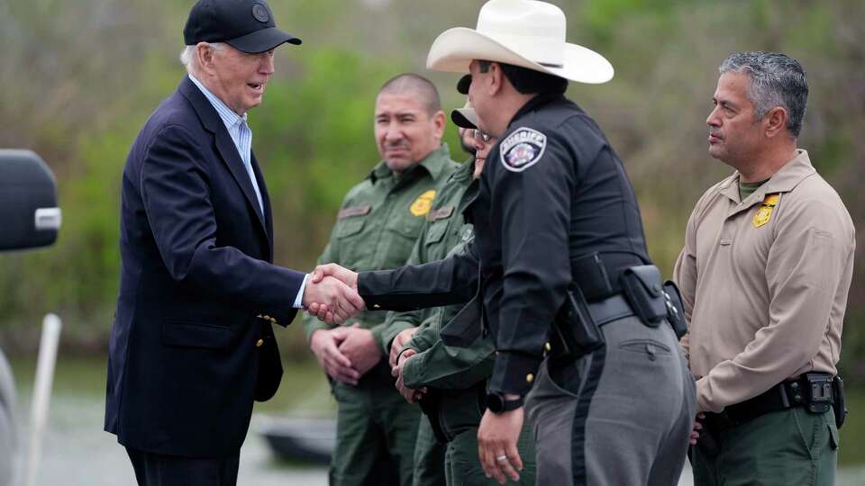 FILE - President Joe Biden talks with the U.S. Border Patrol and local officials, as he looks over the southern border, Feb. 29, 2024, in Brownsville, Texas, along the Rio Grande. Over the course of two weeks, President Joe Biden has imposed significant restrictions on immigrants seeking asylum in the U.S. and then offered potential citizenship to hundreds of thousands of people without legal status already living in the country. The two actions in tandem gives the president a chance to address one of the biggest vulnerabilities for his reelection campaign.