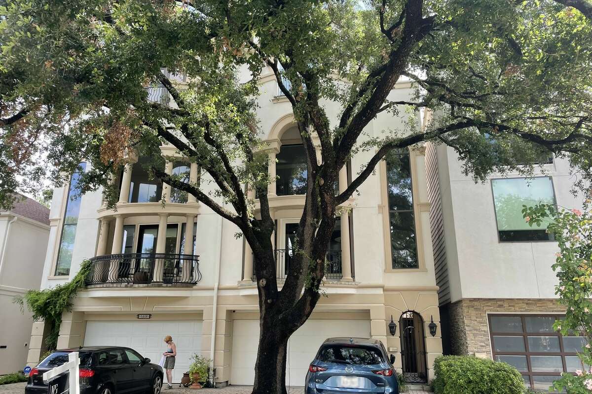 The 'Camp Logan Tree House' on 6506 Rodrigo St was first spotted by eagle-eyed Zillow browsers due to a very unconventional spot for a tree.