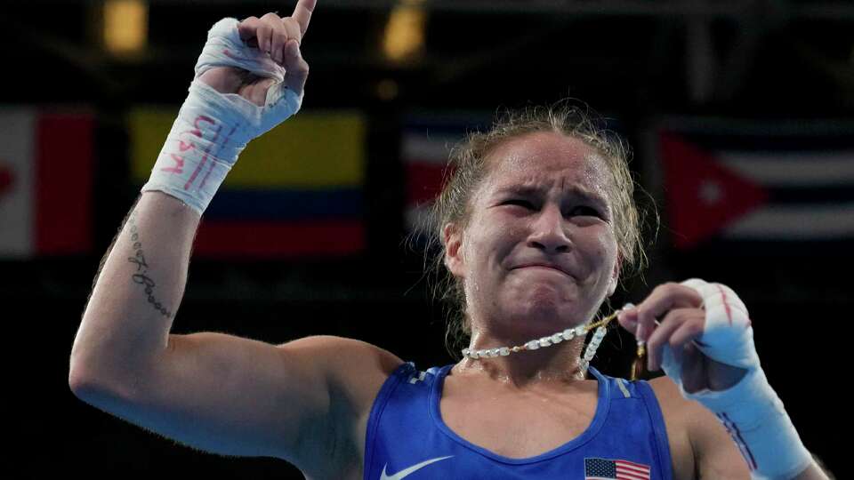 Jennifer Lozano celebrates securing an Olympic berth by beating Canada's Mckenzie Wright in the semifinals of the Pan American Games in Santiago, Chile on Thursday, Oct. 26, 2023.