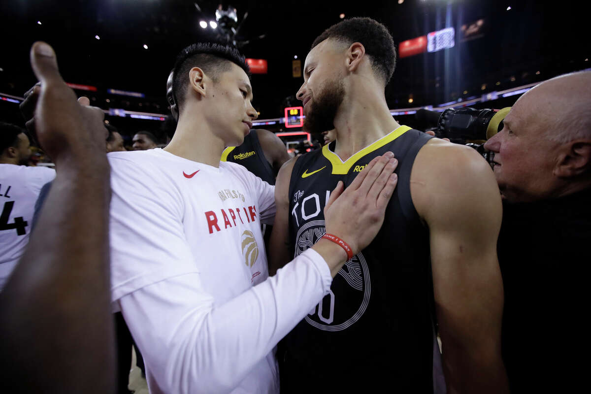 Toronto Raptors guard Jeremy Lin, left, greets Golden State Warriors guard Stephen Curry after the Raptors defeated the Golden State Warriors in Game 6 of basketball's NBA Finals in Oakland, Calif., Thursday, June 13, 2019.