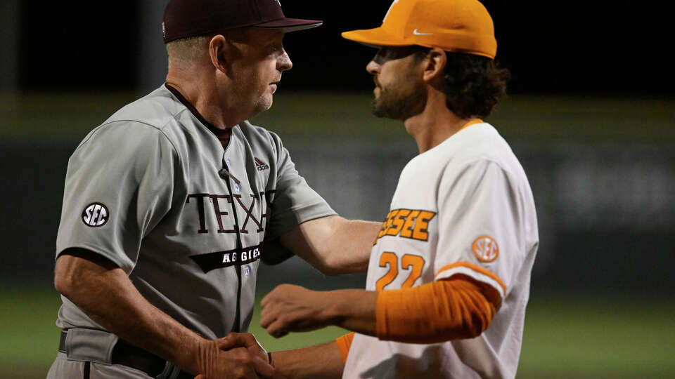 KNOXVILLE, TENNESSEE - MARCH 24: Head coach Jim Schlossnagle of the Texas A&M Aggies and head coach Tony Vitello of the Tennessee Volunteers shake hands after their game at Lindsey Nelson Stadium on March 24, 2023 in Knoxville, Tennessee. (Photo by Eakin Howard/Getty Images)