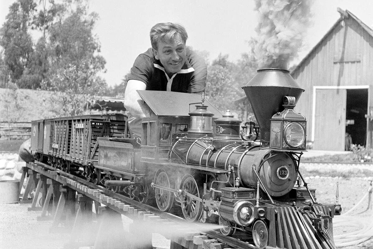 Walt Disney works on a model train in his back yard circa 1955 in Los Angeles, California. (Photo by Earl Theisen/Getty Images)