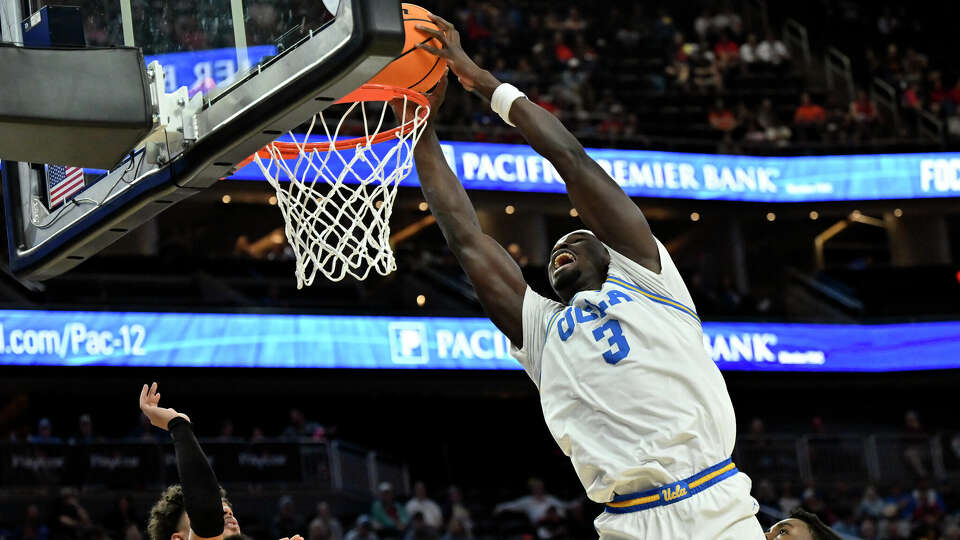 LAS VEGAS, NEVADA - MARCH 13: Adem Bona #3 of the UCLA Bruins goes to dunk the ball against the Oregon State Beavers during the first half of a first round game in the Pac-12 Conference basketball tournament at T-Mobile Arena on March 13, 2024 in Las Vegas, Nevada. The Bruins defeated the Beavers 67-57. (Photo by David Becker/Getty Images)