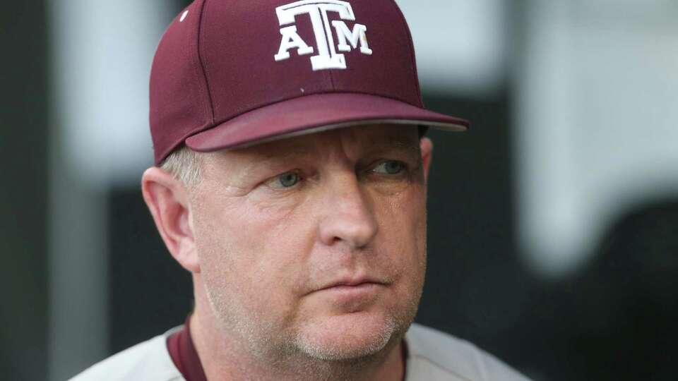 Texas A&M head baseball coach Jim Schlossnagle walks the dugout during game 1 of the Mens College Worlds Series finals against Tennessee at Charles Schwab field on Saturday, June 22, 2024, in Omaha.