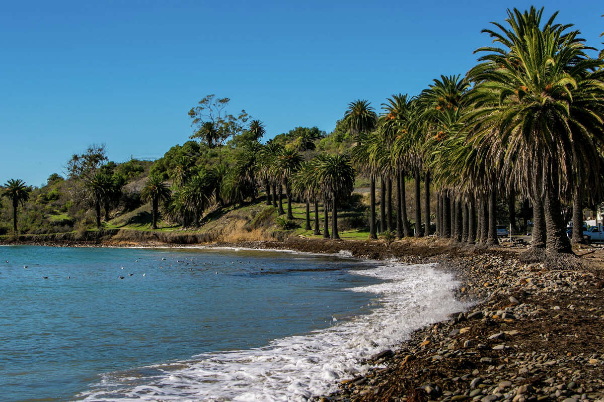 FILE - Waves break along the rocky shore at Refugio State Beach on December 24, 2014, in Santa Barbara.