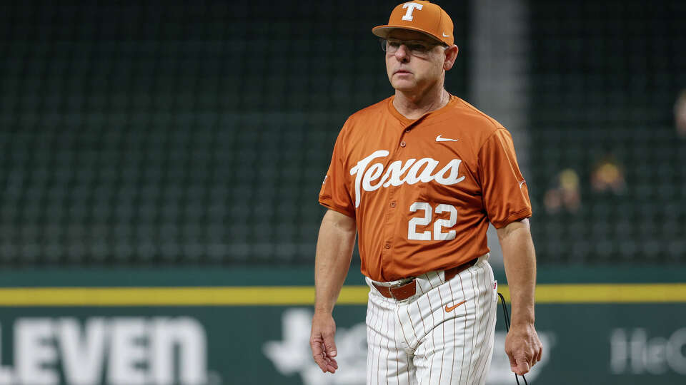 Texas head coach David Pierce walks off the field after talking to the pitcher during a 2024 Phillips 66 Big 12 Baseball tournament game in Arlington against Cincinnati on May 22, 2024.