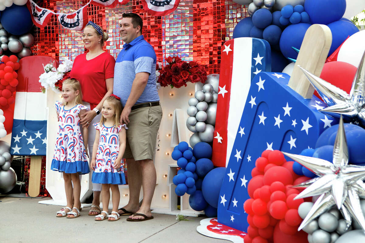 The Walker family poses for a photo before the annual South Montgomery County 4th of July Parade at Market Street, Tuesday, July 4, 2023, in The Woodlands.