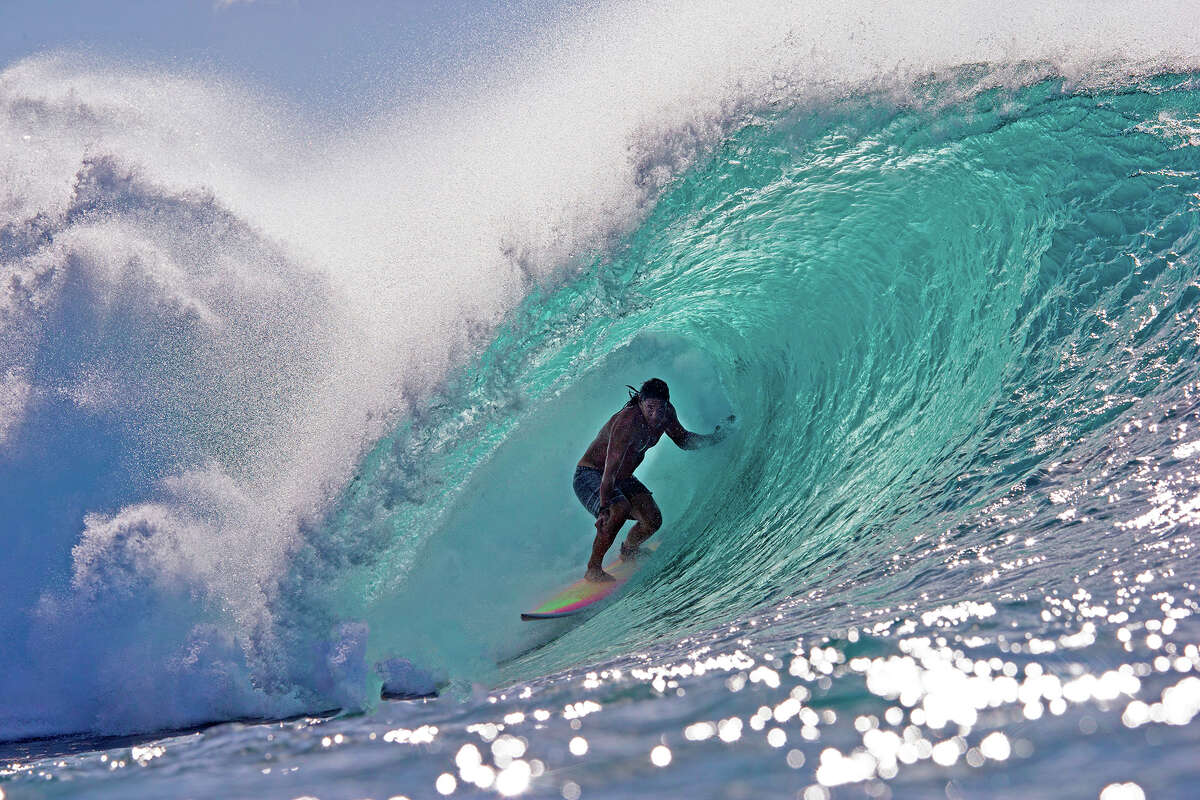 Hawaii's Tamayo Perry surfs while practicing for Da Hui Backdoor shootout at the Pipeline Masters on Oahu's North Shore, Hawaii on January 2, 2019.