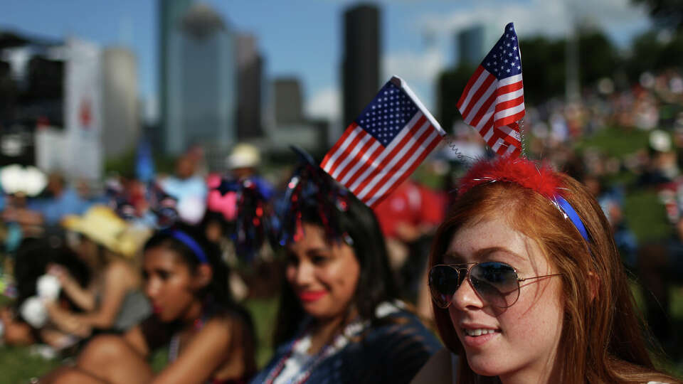 Claudia Knoll, right, 19, Megan Gusman, center, 19, and Hailee Higgins, 19, enjoy the performance of The Suffers at the Freedom Over Texas festival, Monday, July 4, 2016, in Houston. ( Marie D. De Jesus / Houston Chronicle )