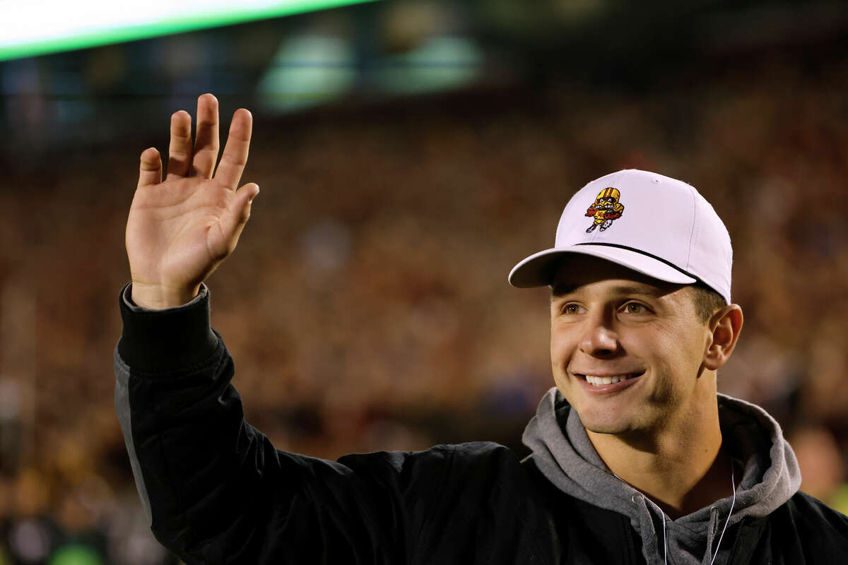 Former Iowa State Cyclones quarterback Brock Purdy waves to the home crowd as they take on the Kansas Jayhawks in the first half of play at Jack Trice Stadium on Nov. 4, 2023 in Ames, Iowa.