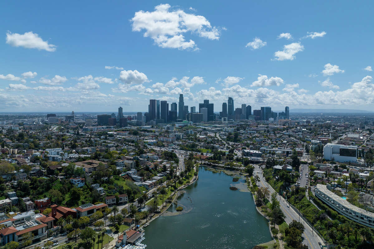 Los Angeles, CA - March 29: Storm clouds move out of the Los Angeles Basin in a view over Echo Park Lake toward downtown on Wednesday, March 29, 2023 in Los Angeles, CA. (Brian van der Brug / Los Angeles Times via Getty Images)