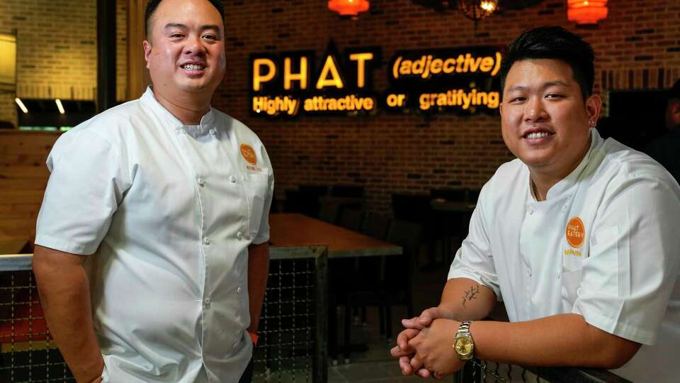 Chefs Kevin Lee, left, and Marvin He pose for a portrait at the newest location of Phat Eatery, which specializes in freshly prepared Malaysian street food, and a relaxed atmosphere, on Monday, June 24, 2024 in The Woodlands. The original restaurant opened in Katy six years ago and this Woodlands location is its second. Founded by chef Alex Au-Yeung, who died of cancer earlier this year. Now Lee and He are running the restaurant.