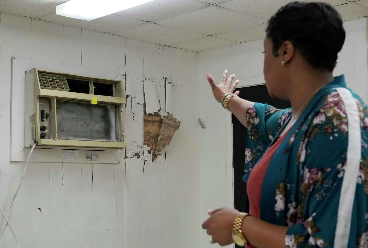 LaKia Jackson, principal, talks about wall damage in a temporary building used as classrooms at Fondren Middle School, 6333 S. Braeswood Blvd., Tuesday, June 25, 2024, in Houston.