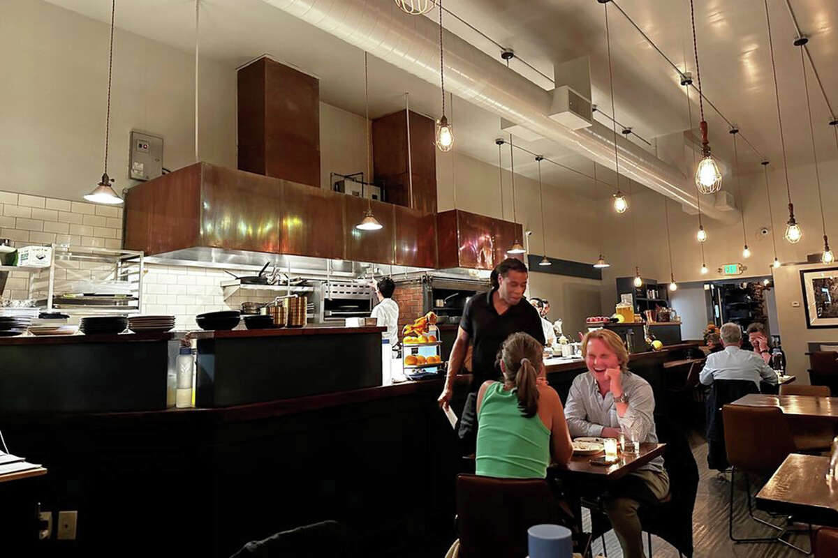 Oakland restaurant Pomet charges customers a 20% service fee that is evenly distributed to employees instead of the traditional tipping system.