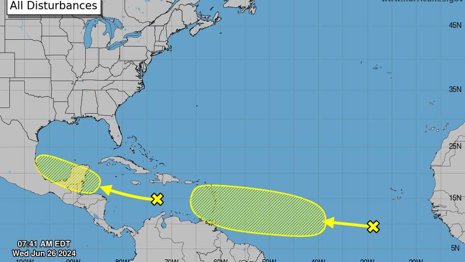 The National Hurricane Center is tracking two westward-moving tropical waves, one in the Caribbean Sea and one in the tropical Atlantic, that feature disorganized clusters of thunderstorms.