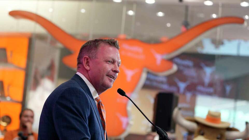 Jim Schlossnagle speaks at a news conference after he was introduced as the new NCAA college head baseball coach at Texas, Wednesday, June 26, 2024, in Austin, Texas. Schlossnagle left rival program Texas A&M. (AP Photo/Eric Gay)