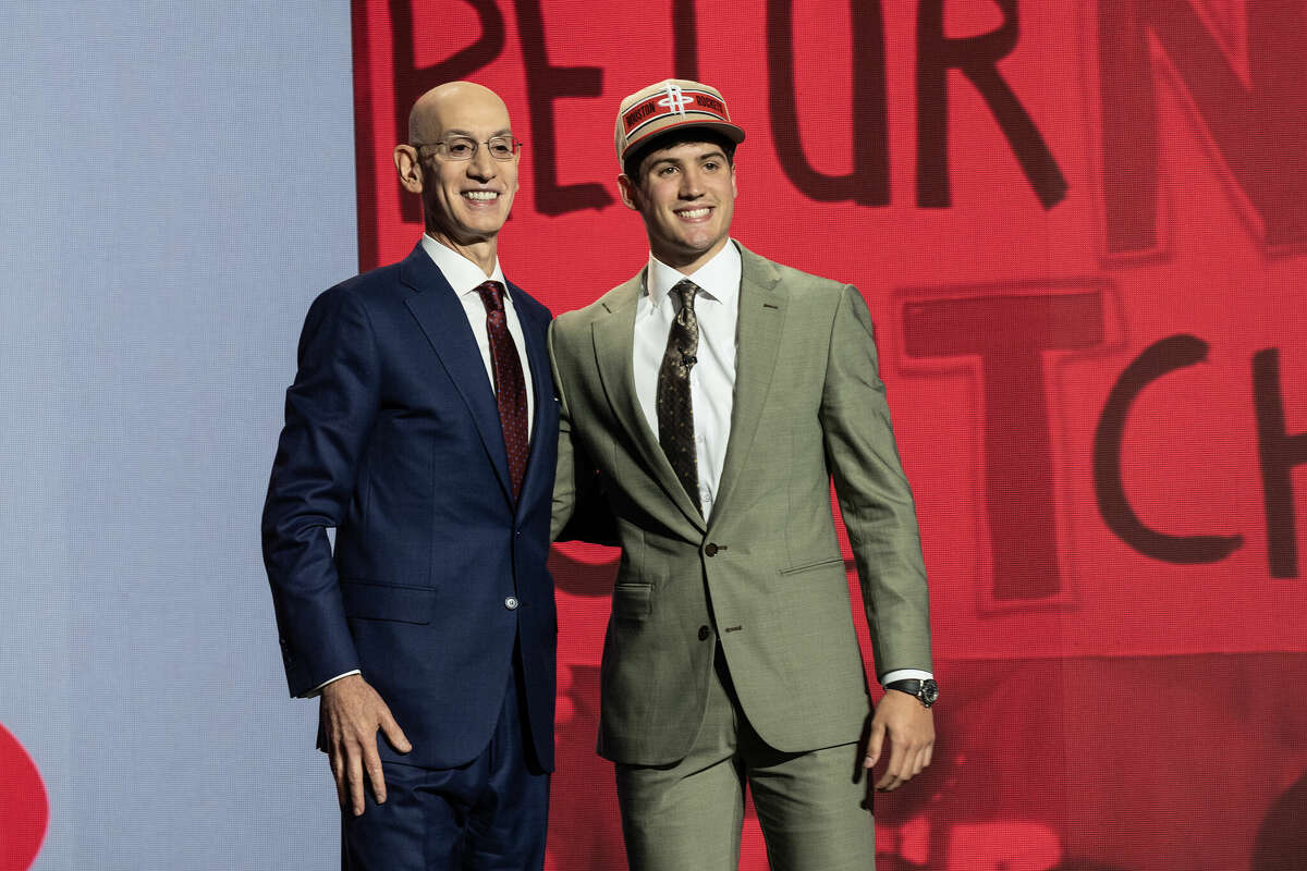 NEW YORK, UNITED STATES - JUNE 26: Commissioner Adam Silver shakes hands with Reed Sheppard, selected as number three by the Houston Rockets, in the first round of the 2024 NBA Draft at the Barclays Center in Brooklyn, New York on June 26, 2024 (Photo by Lev Radin/Anadolu via Getty Images)