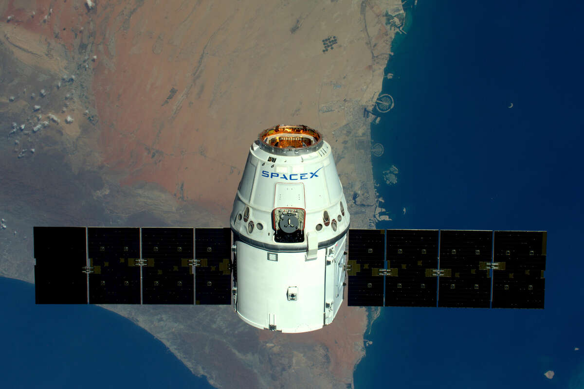 This handout image supplied by the European Space Agency (ESA), shows a view of The Palms, Dubai as the SpaceX Dragon spacecraft passes below, in an image taken by ESA astronaut Tim Peake from the International Space Station on April 10, 2016. 