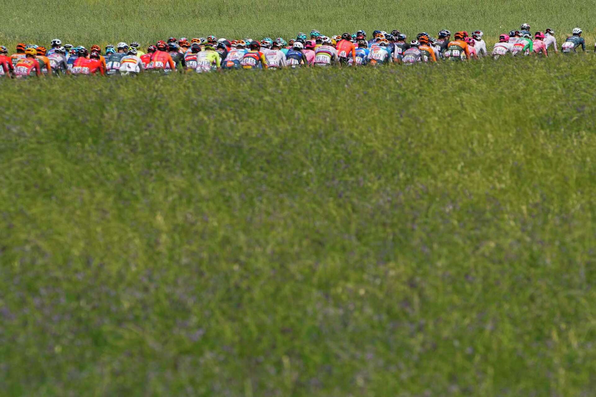 AP PHOTOS A race to capture the Tour de France before it flies by