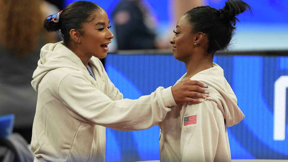 Simone Biles and Jordan Chiles speak between events at the United States Gymnastics Olympic Trials on Friday, June 28, 2024, in Minneapolis. (AP Photo/Abbie Parr)