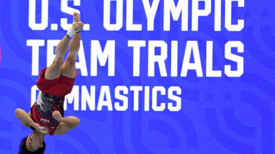 Asher Hong competes in the floor exercise at the United States Gymnastics Olympic Trials on Saturday, June 29, 2024, in Minneapolis. (AP Photo/Abbie Parr)