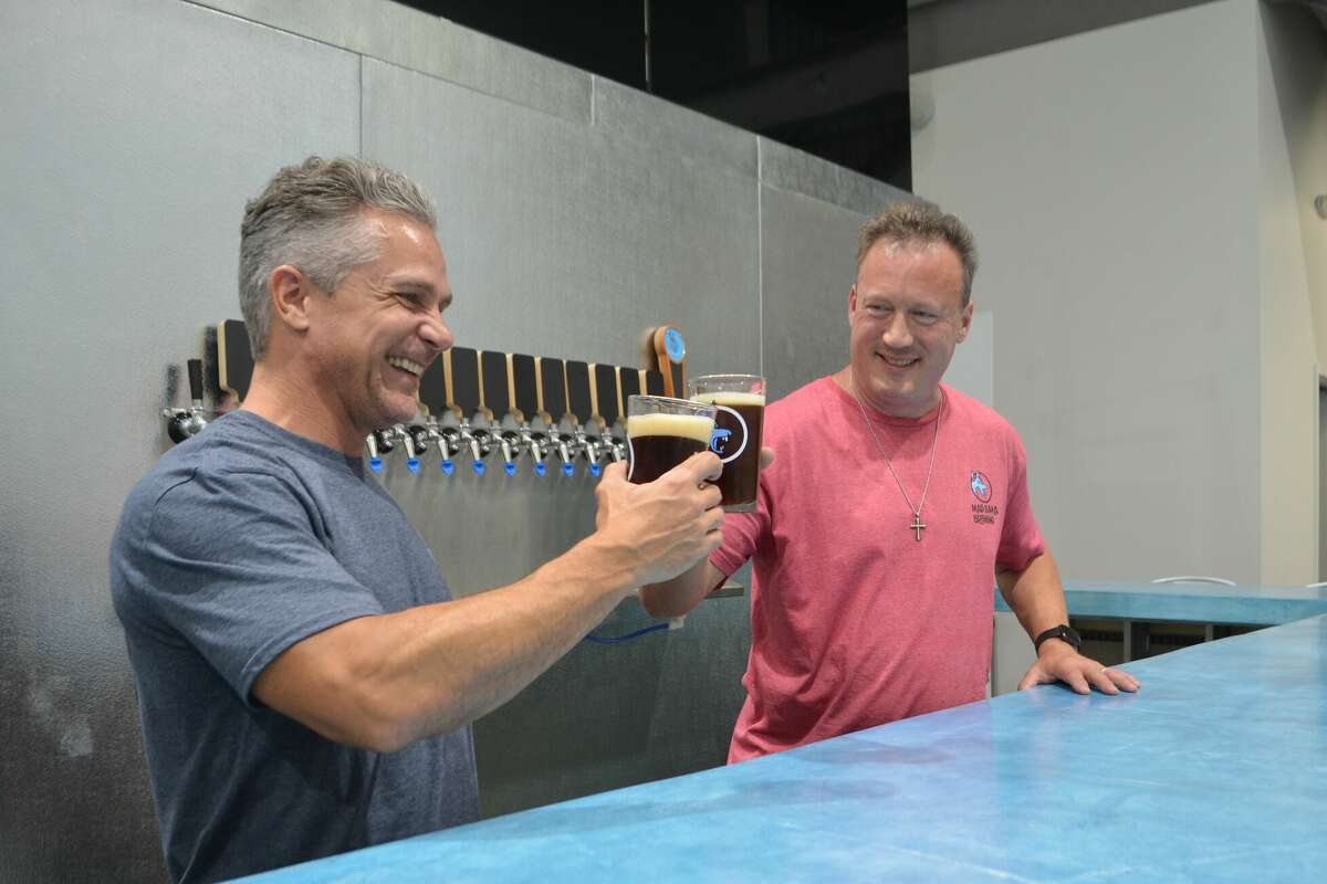 Arrian Brantley, left, and Stephen Daulong of Mad Llama Brewing at their brewery and taproom in Spring.