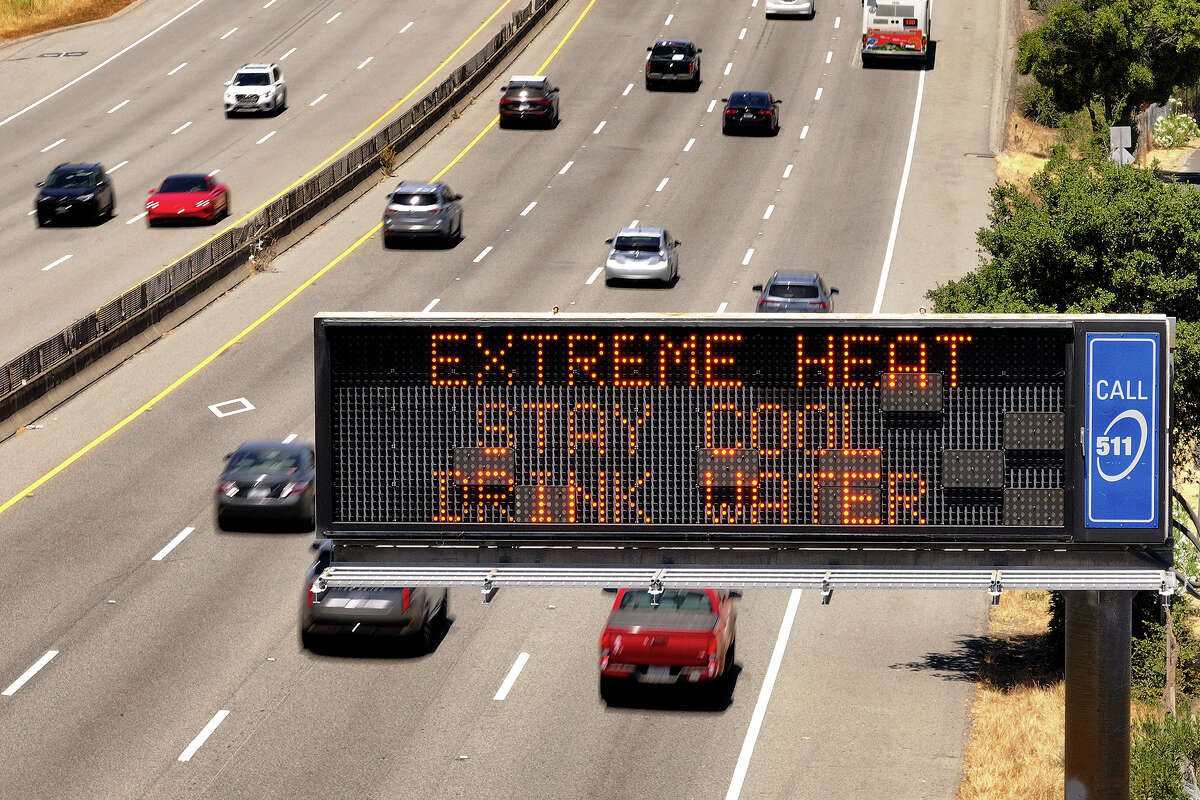 In an aerial view, a Caltrans changeable message sign on Highway 101 displays a warning about extreme heat on July 02, 2024 in Corte Madera, California.