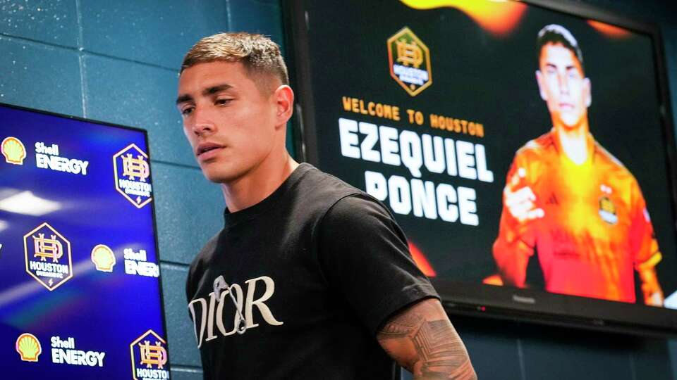 Houston Dynamo forward Ezequiel Ponce walks to the stand for his introductory news conference on Wednesday, July 3, 2024 in Houston. The Dynamo signed Ponce, 27, on a full transfer from AEK Athens in Greece through June 2027 with club options for December 2027 and 2028. Houston completed the signing of Ponce for an undisclosed figure the team called “the largest transfer fee in club history.”