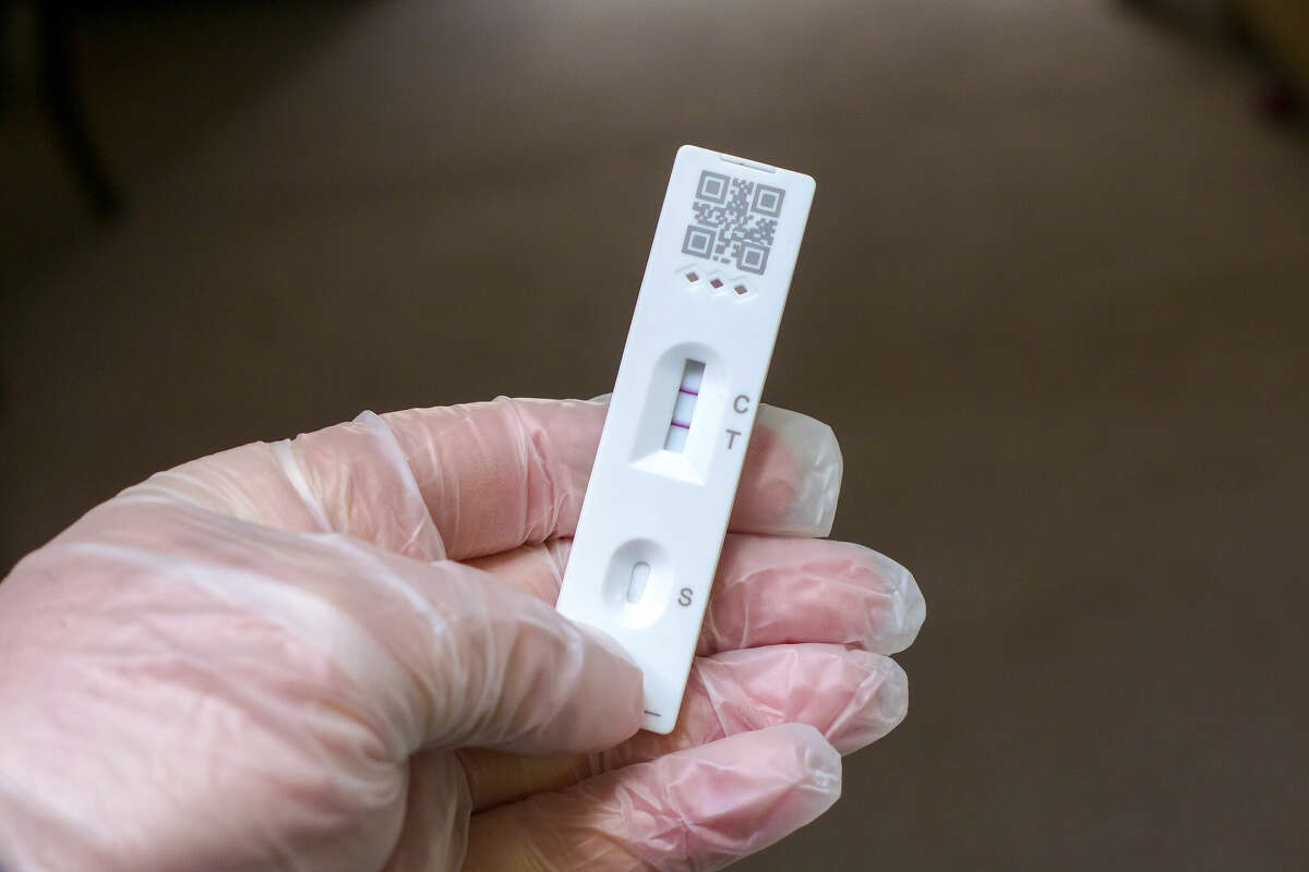 FILE: A positive COVID-19 rapid test. 